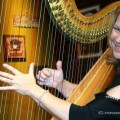 Lori Andrews and her harp on the set of House Blend