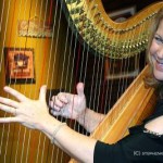 Lori Andrews and her harp on the set of House Blend