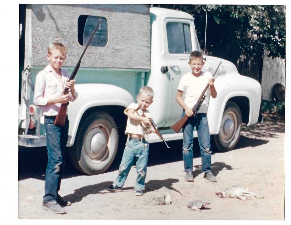 After a rabbit hunt, Boyd, Harold and Mack Elder pose in front of Uncle Buck's pickup, Valentine, summer 1956. Photo: Courtesy Boyd Elder Estate.