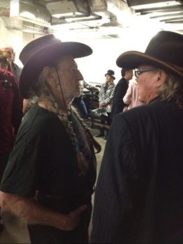 Willie Nelson and Boyd Elder swap tall tales backstage. Photo: Courtesy Boyd Elder Estate.